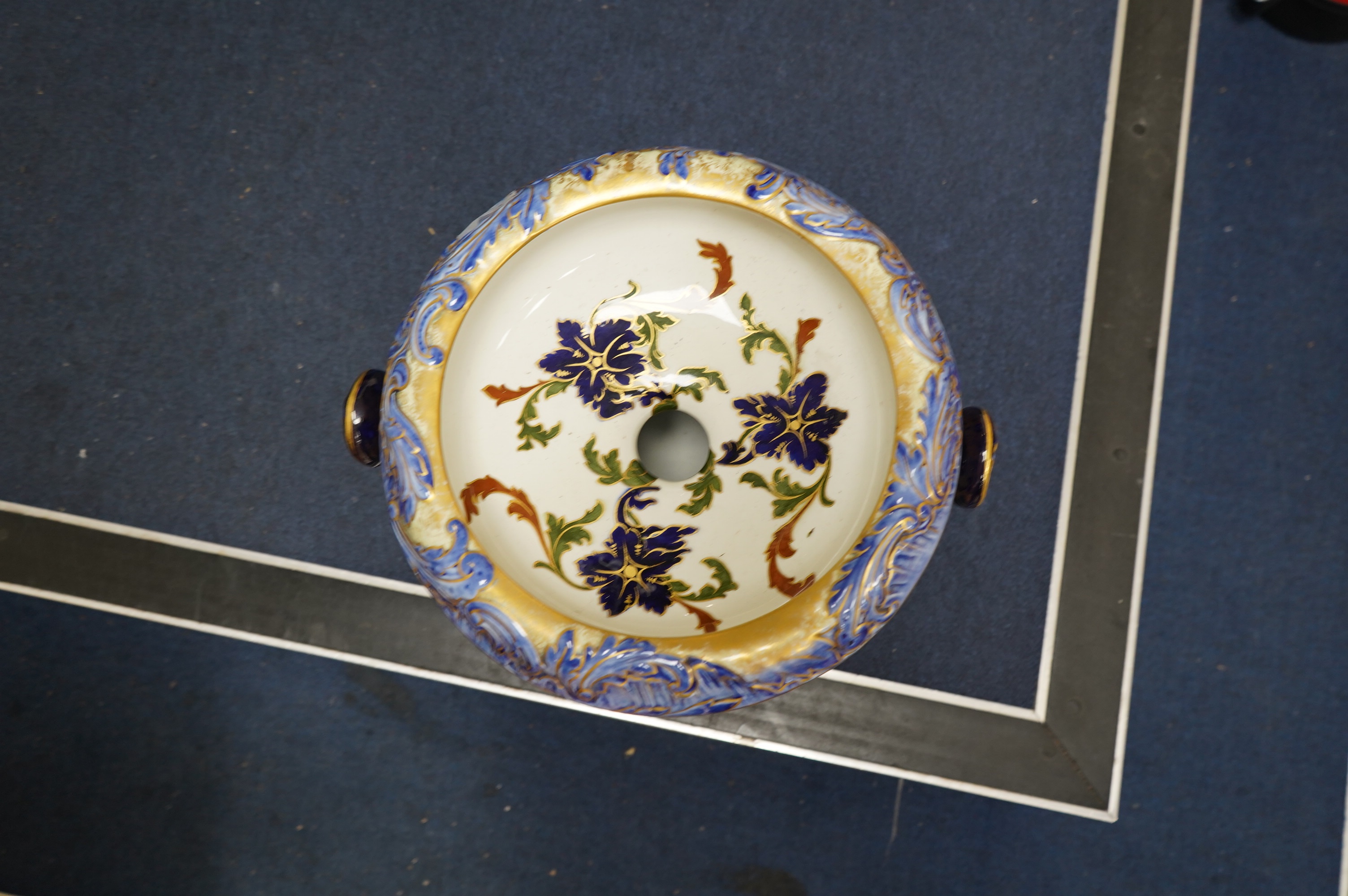 A Victorian Royal Doulton gilt and floral decorated pail, 28cm high. Condition - poor, crack to back